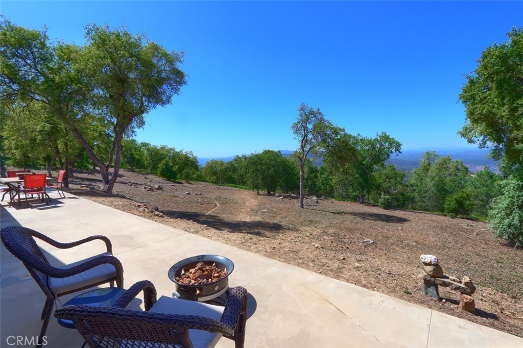 6097 Sherlock Road Midpines, CA 95345 - Photo 38 of 63 a view of a backyard with sitting area
