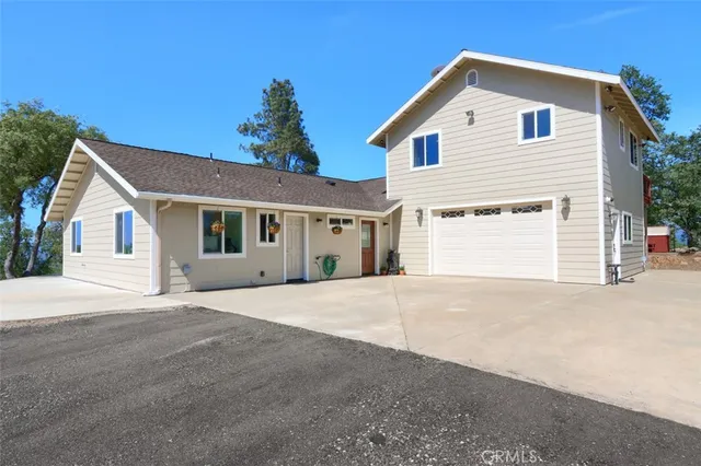 a view of a lush green hillside and a houses