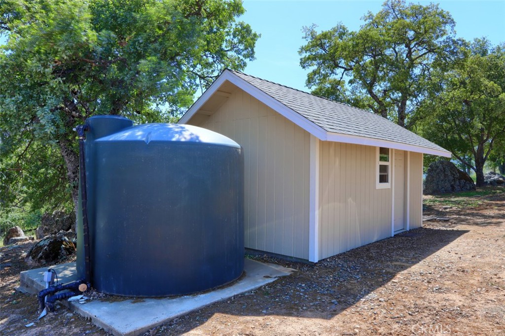 6097 Sherlock Road Midpines, CA 95345 - Photo 50 of 63 a backyard of a house with an outdoor space