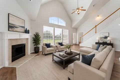 a open kitchen with kitchen island a large counter top space a sink stainless steel appliances and cabinets