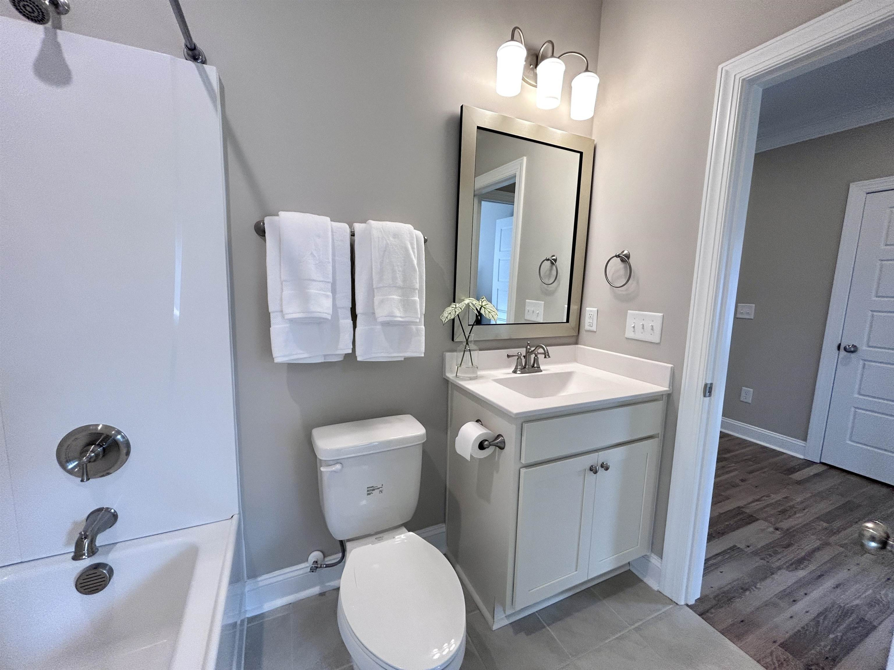 204 Kavanaugh Road Wake Forest, NC 27587 - Photo 11 of 53 a bathroom with a toilet sink and mirror