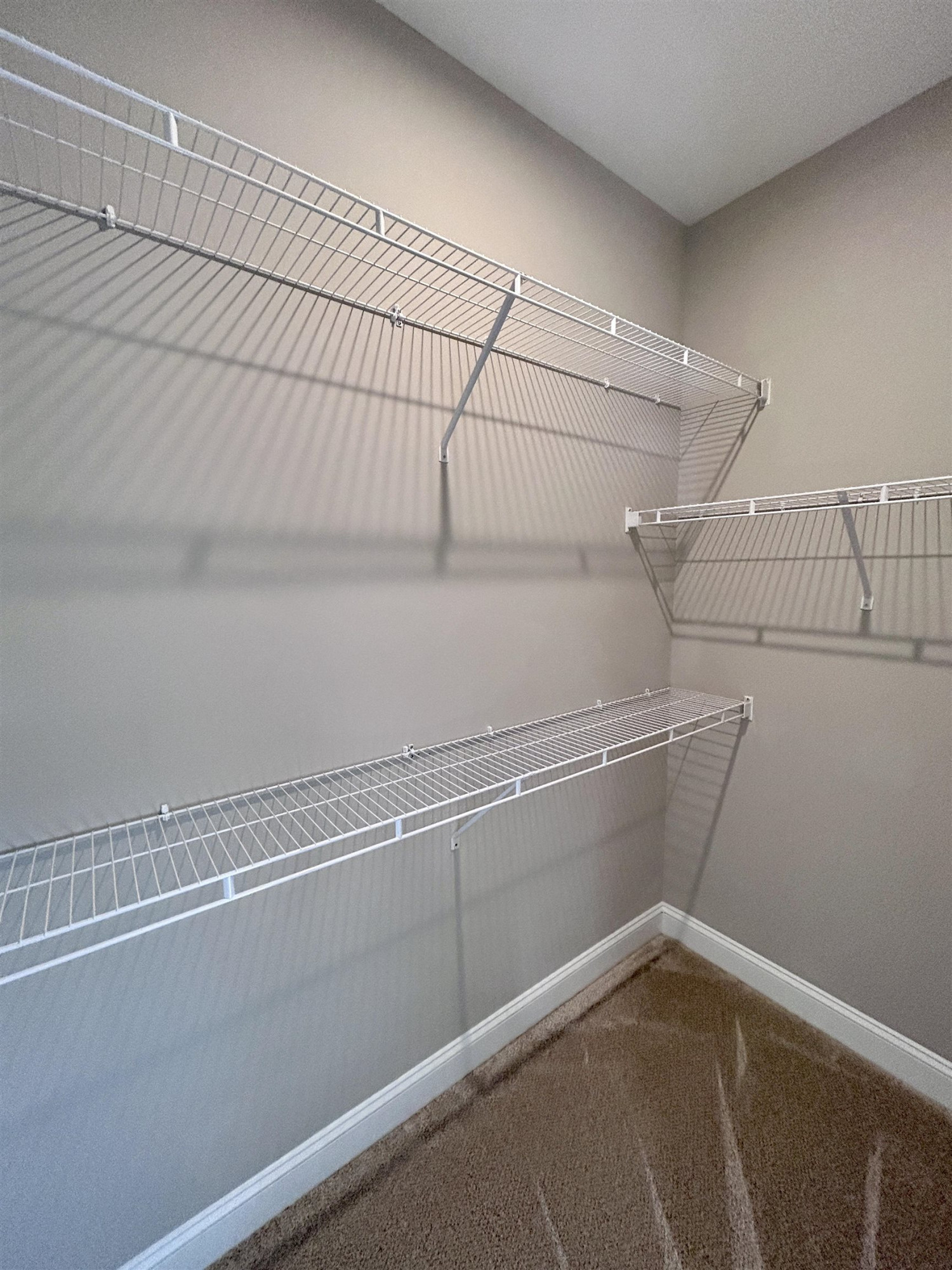 204 Kavanaugh Road Wake Forest, NC 27587 - Photo 12 of 53 a view of a room with racks on the wall