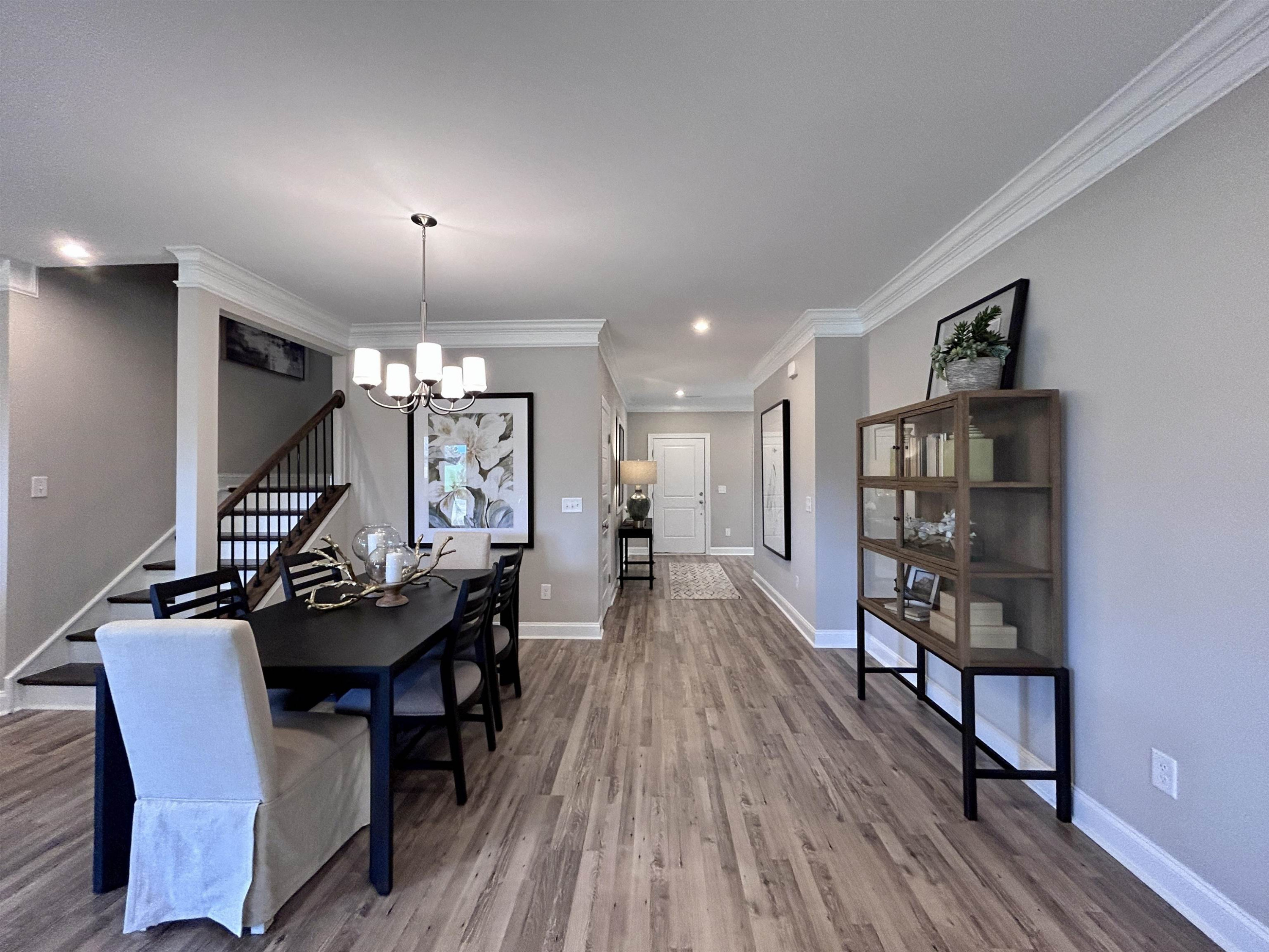 204 Kavanaugh Road Wake Forest, NC 27587 - Photo 13 of 53 a dining room with furniture and wooden floor
