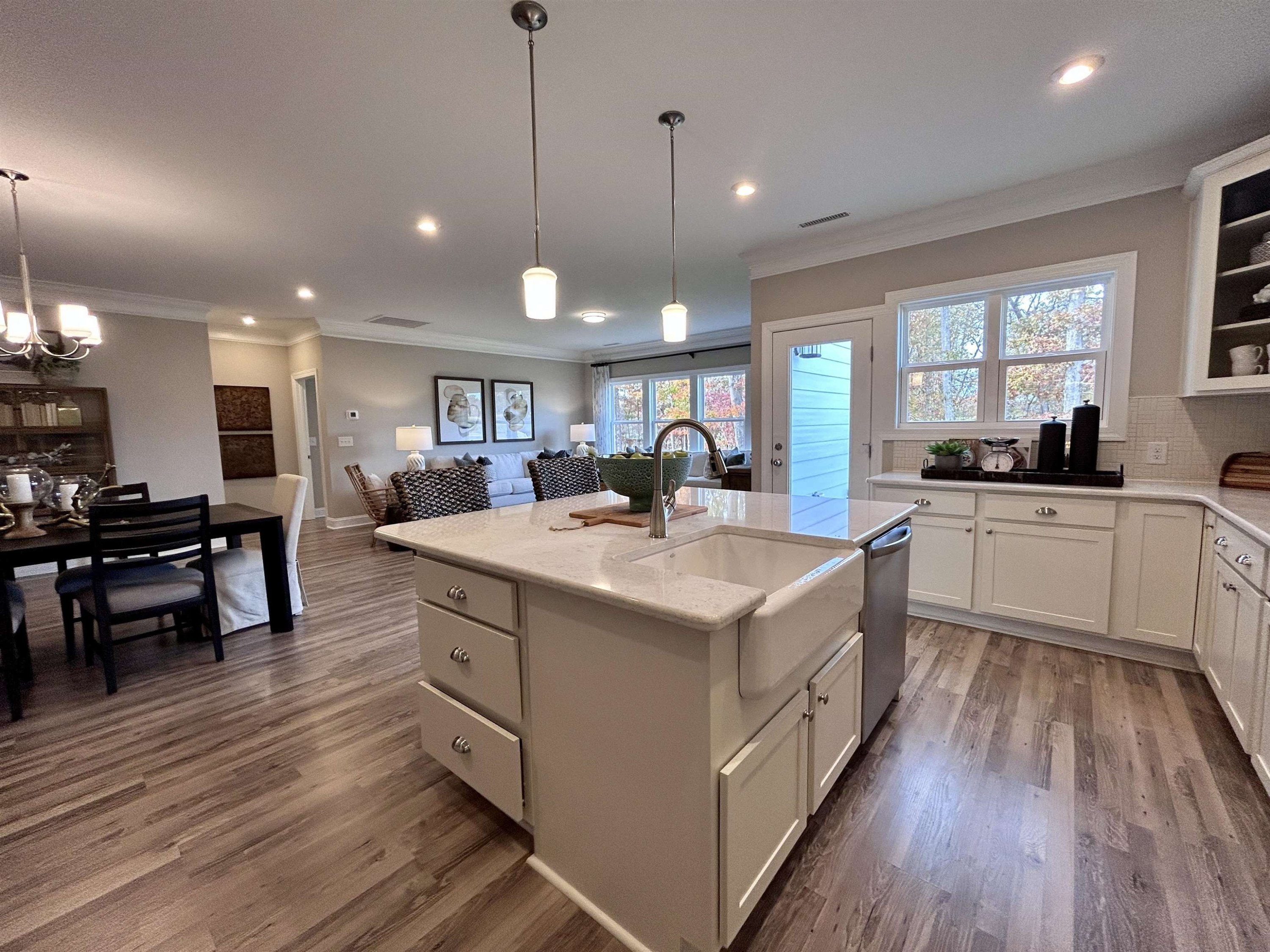 204 Kavanaugh Road Wake Forest, NC 27587 - Photo 20 of 53 a view of a kitchen counter space a sink wooden floor and living room view