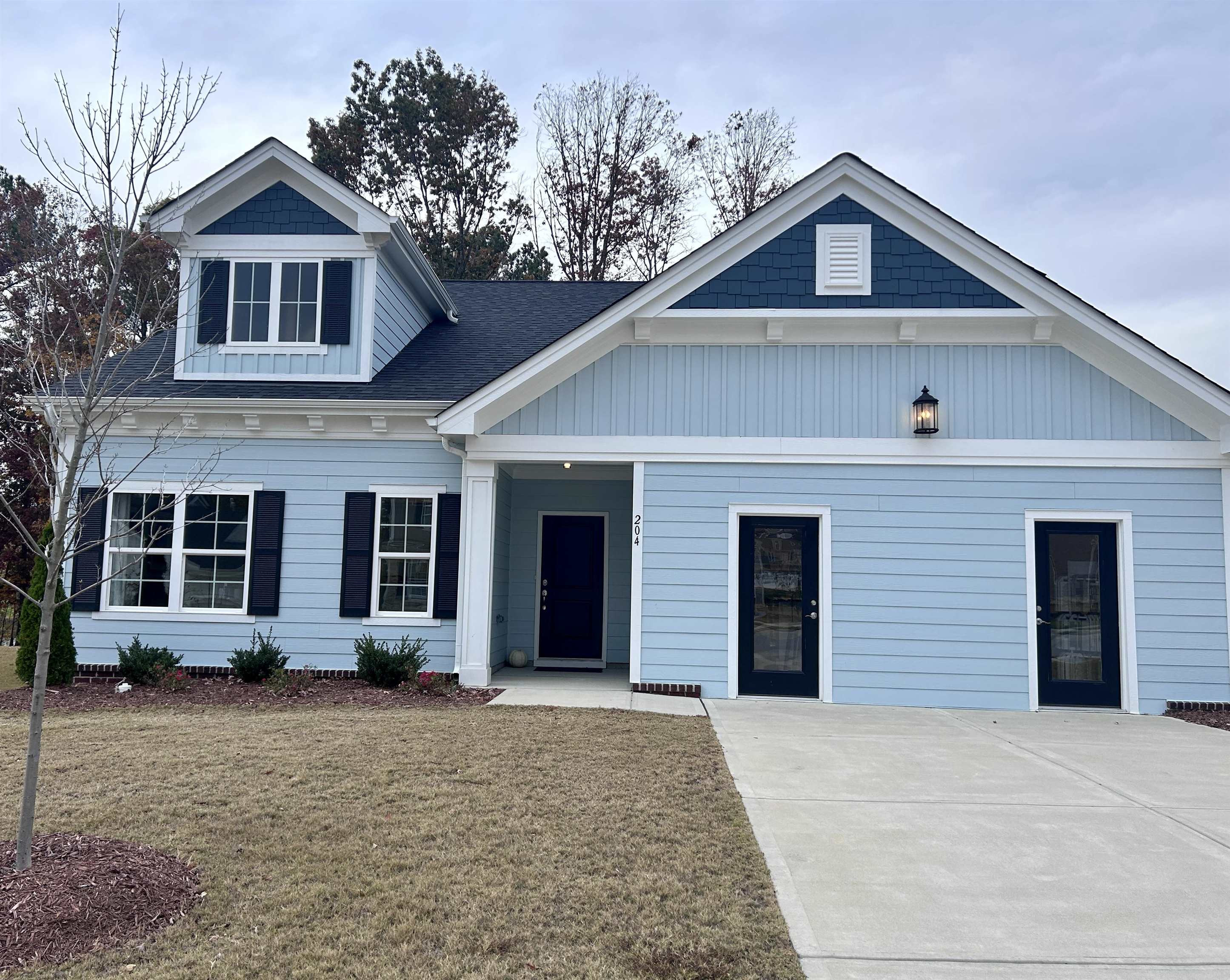 204 Kavanaugh Road Wake Forest, NC 27587 - Photo 2 of 53 a front view of a house with a yard