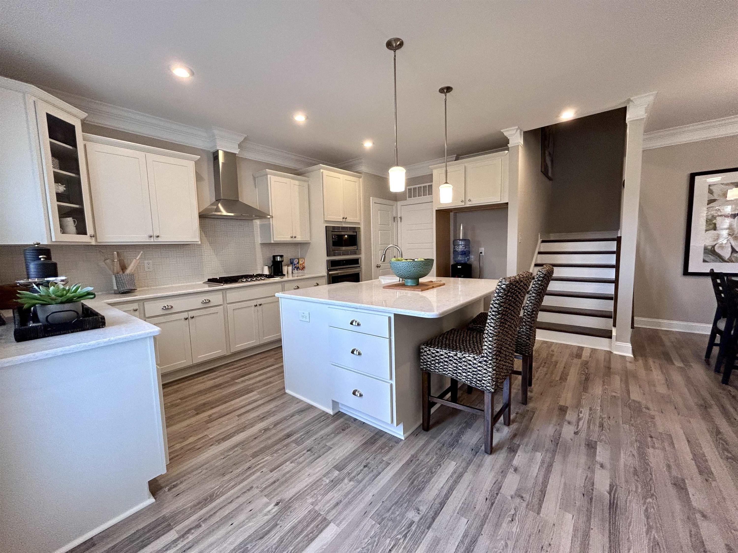 204 Kavanaugh Road Wake Forest, NC 27587 - Photo 22 of 53 a kitchen with a table chairs refrigerator and cabinets