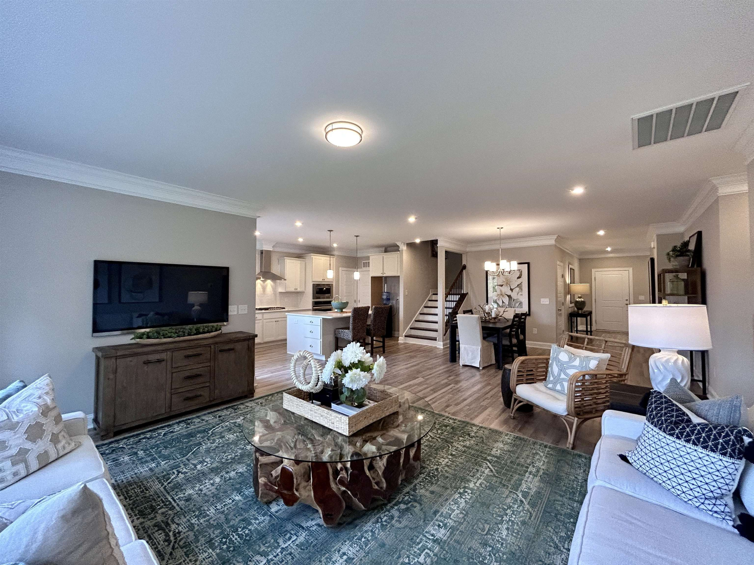 204 Kavanaugh Road Wake Forest, NC 27587 - Photo 27 of 53 a living room with furniture a flat screen tv and kitchen view