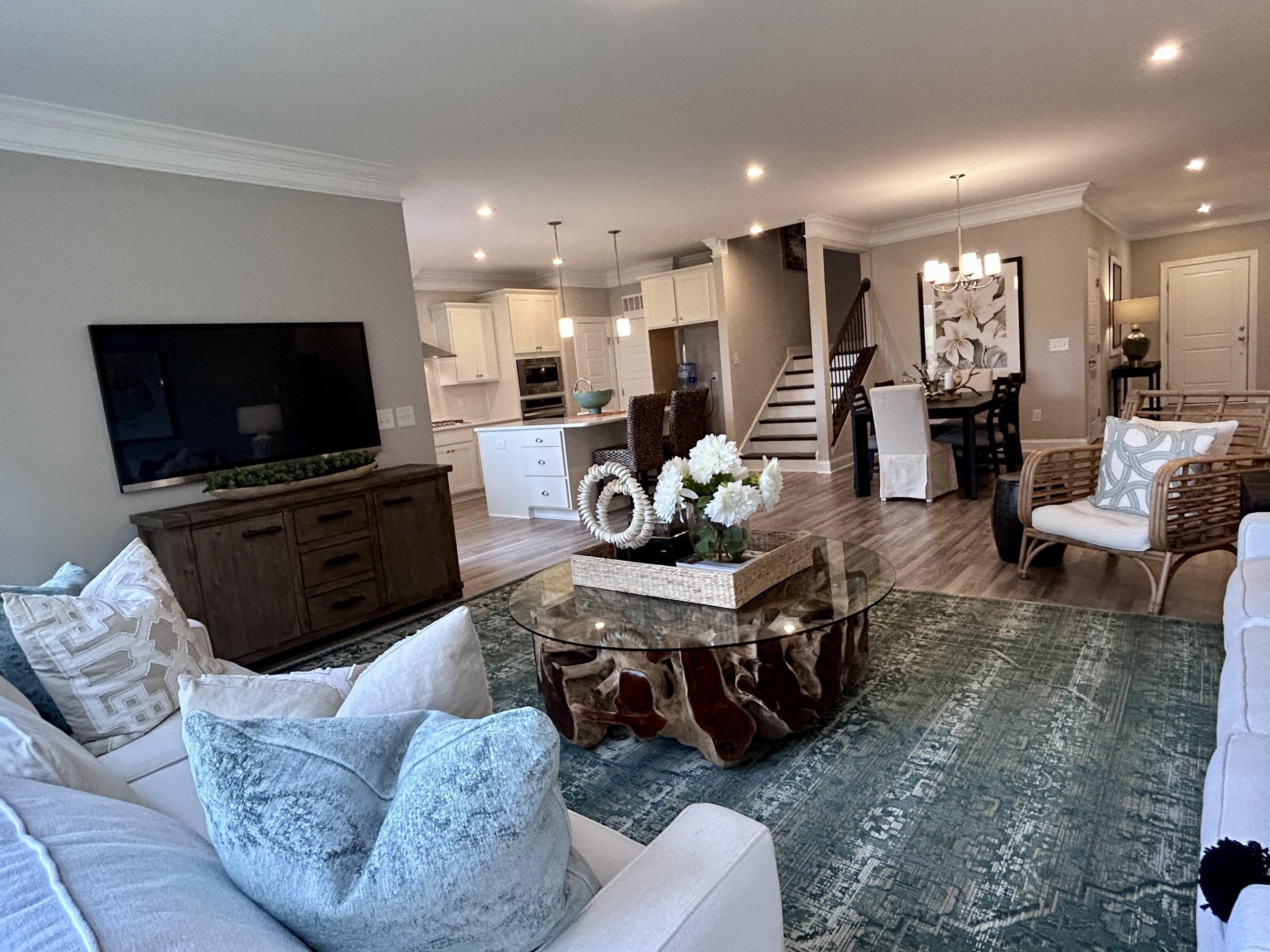 204 Kavanaugh Road Wake Forest, NC 27587 - Photo 28 of 53 a living room with furniture and a flat screen tv