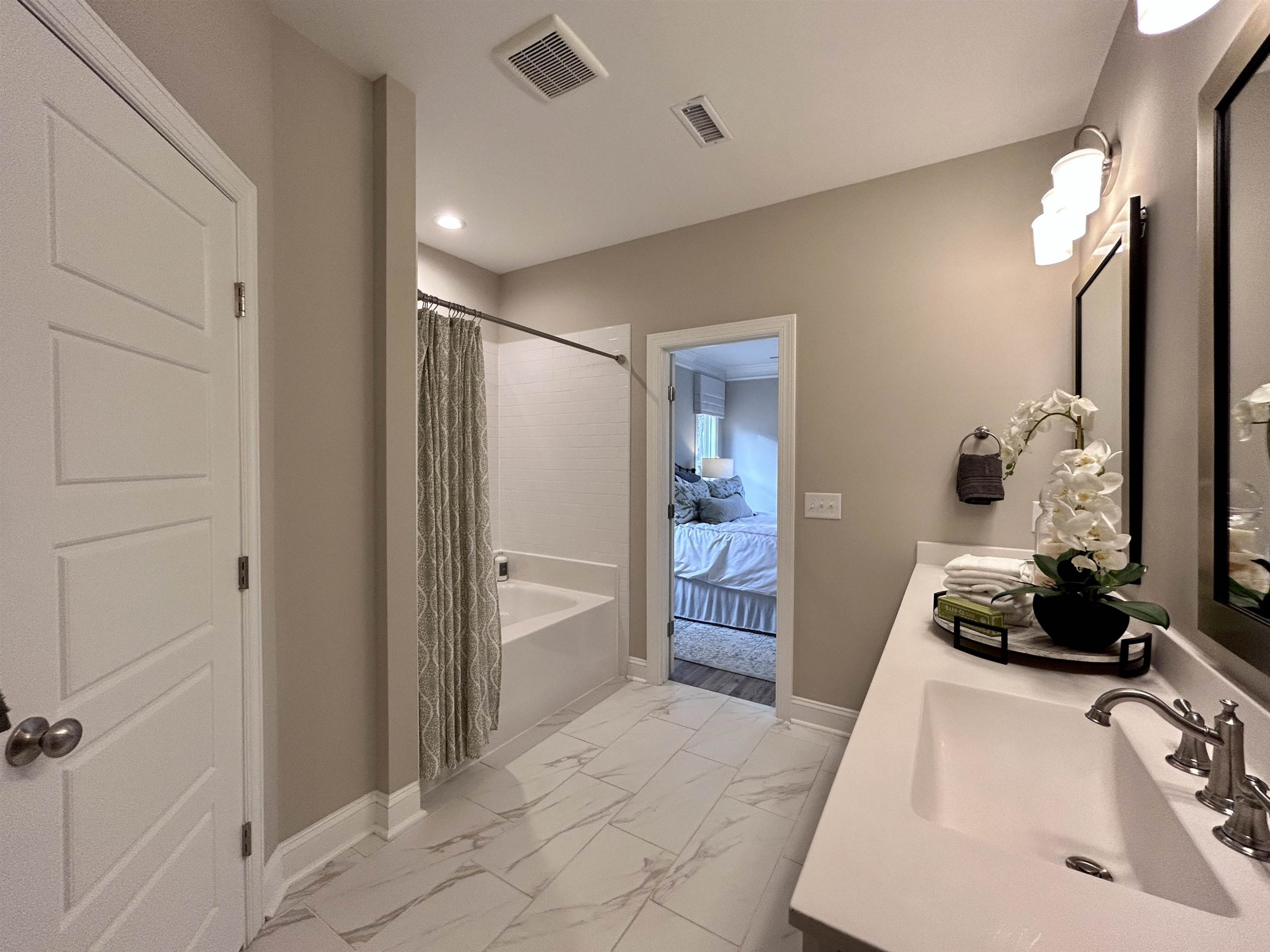 204 Kavanaugh Road Wake Forest, NC 27587 - Photo 42 of 53 a bedroom with a bed and a dresser