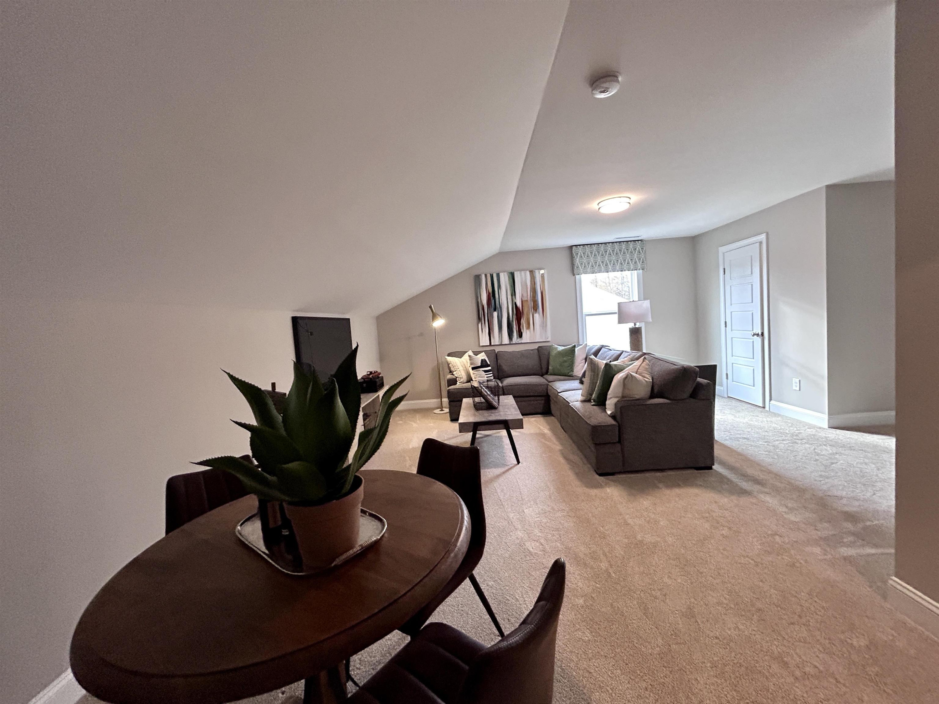 204 Kavanaugh Road Wake Forest, NC 27587 - Photo 50 of 53 a living room with furniture potted plant and a window