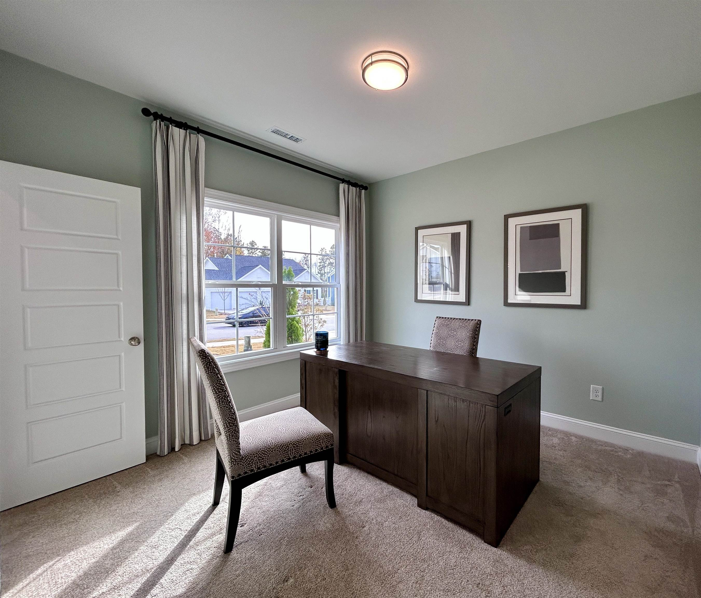204 Kavanaugh Road Wake Forest, NC 27587 - Photo 7 of 53 a living room with furniture and a window