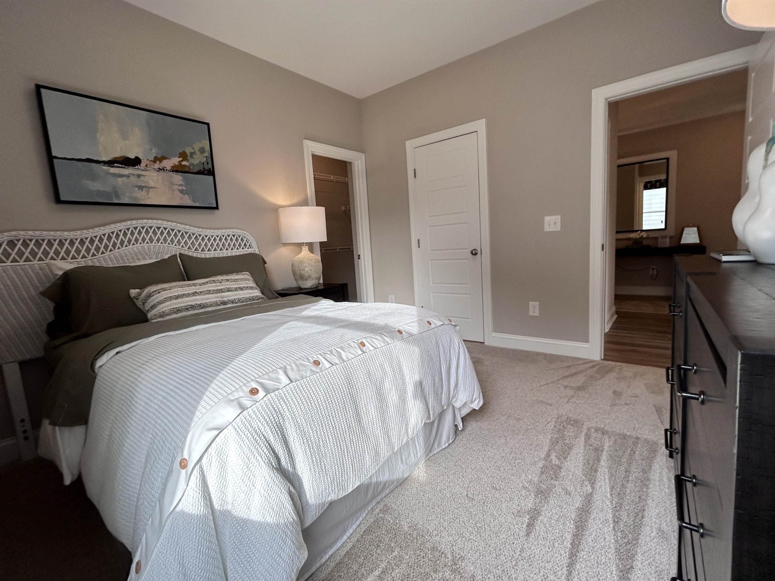 204 Kavanaugh Road Wake Forest, NC 27587 - Photo 9 of 53 a bedroom with a bed and a lamp