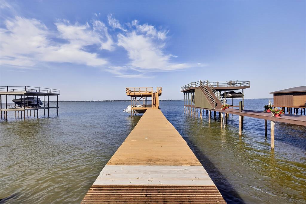 1113 Rim O The World Drive Tool, TX 75143 - Photo 30 of 40 This is the best waterview you could want - wide open and deep water. The boathouse is a double deck with a single pontoon boat slip, shade area for the fishermen and the upper deck for the serious bird watchers and sun bathers.