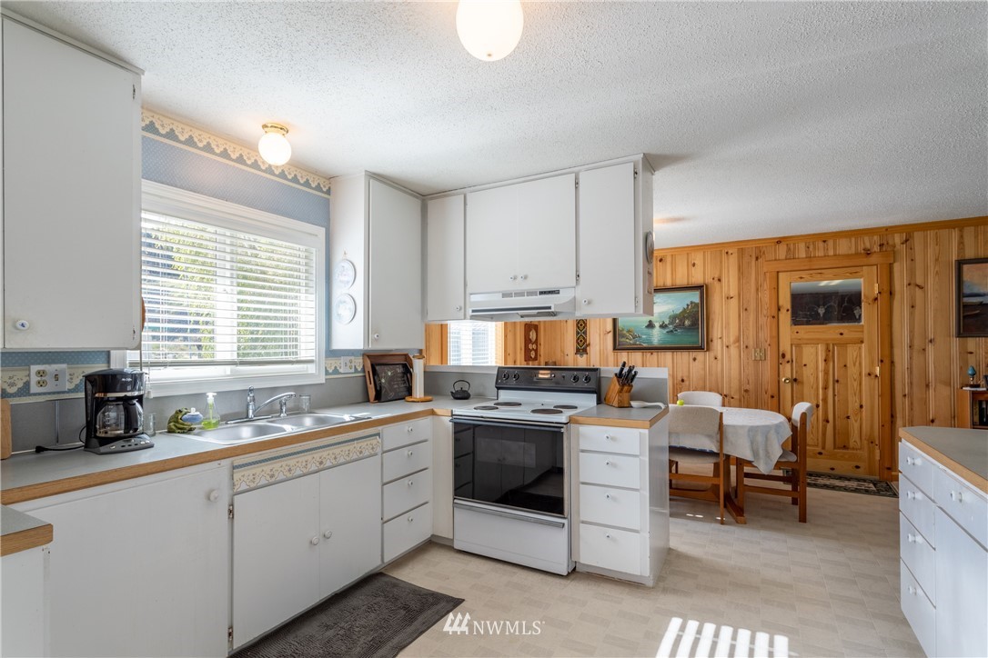 700 Coulee Meadows Road Waterville, WA 98858 - Photo 6 of 25 a kitchen with a sink stove and cabinets