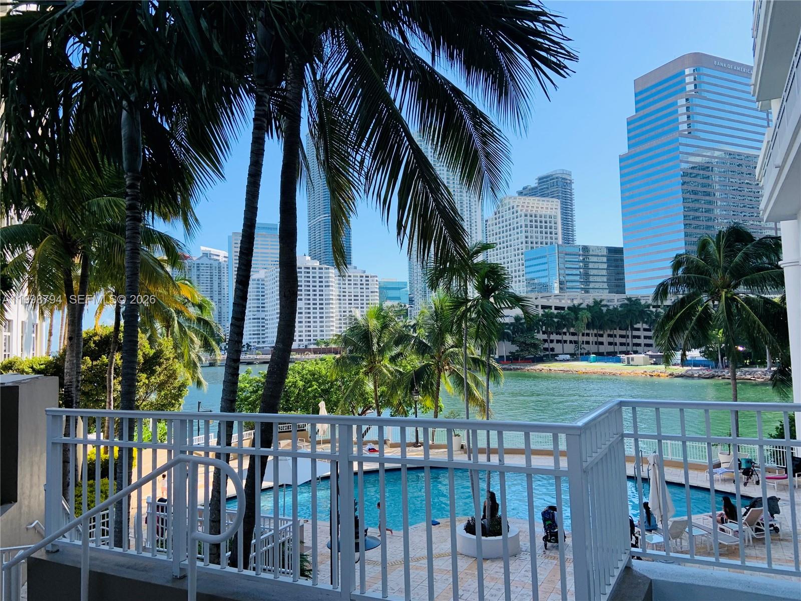 801 Brickell Key Boulevard, Unit 3207 Miami, FL 33131 - Photo 11 of 67 a view of outdoor space with swimming pool and furniture