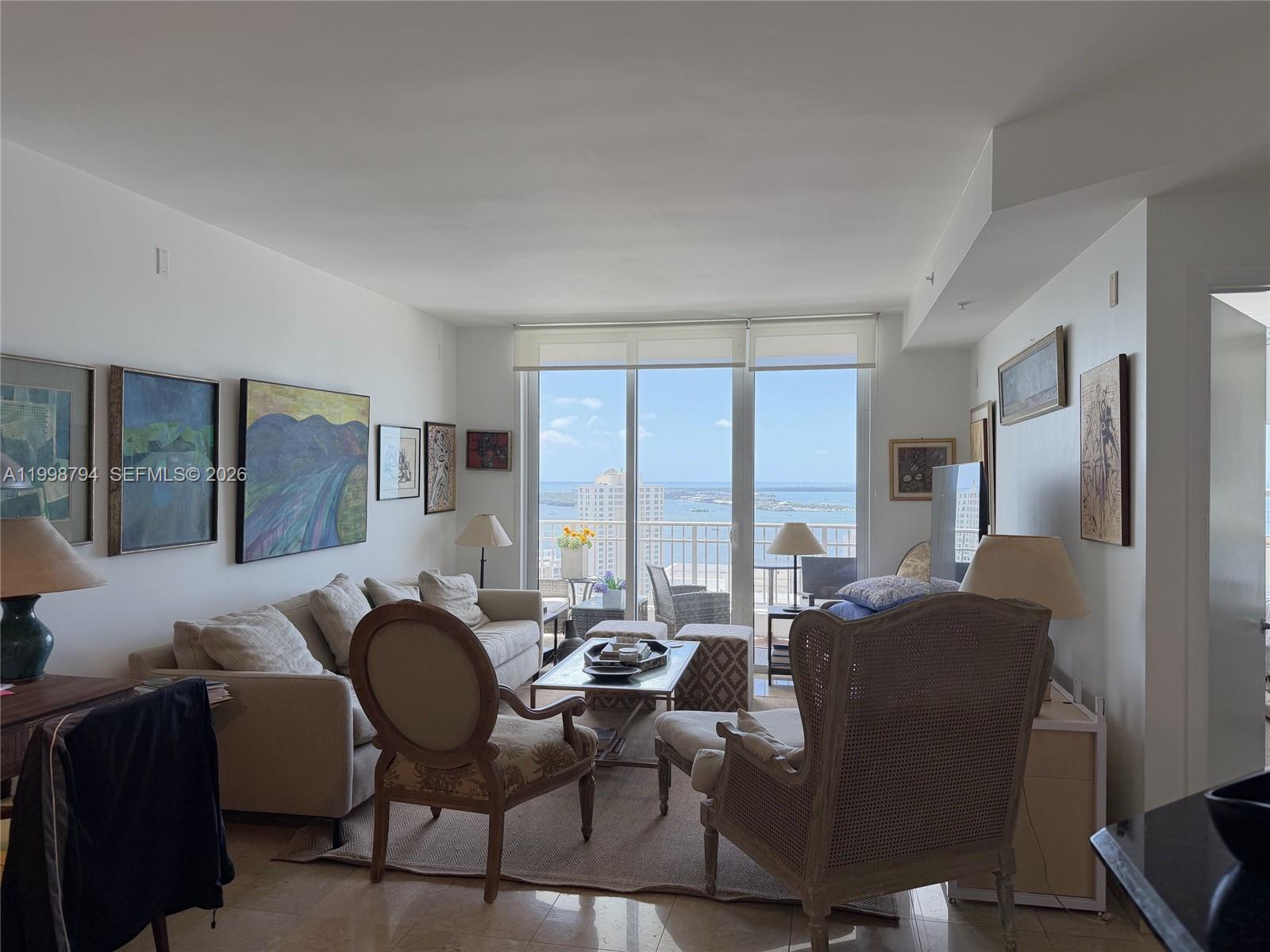 801 Brickell Key Boulevard, Unit 3207 Miami, FL 33131 - Photo 18 of 67 a view of a dining room with furniture window and outside view