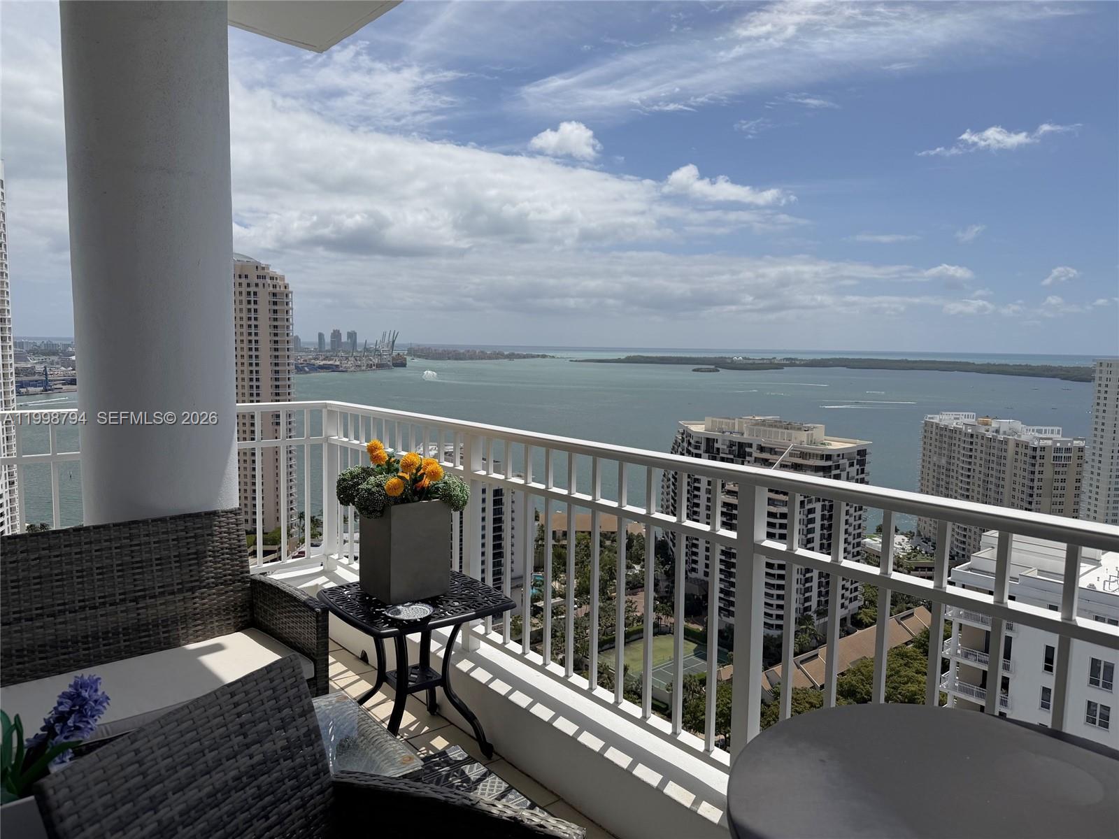 801 Brickell Key Boulevard, Unit 3207 Miami, FL 33131 - Photo 2 of 67 a view of a balcony with wooden floor