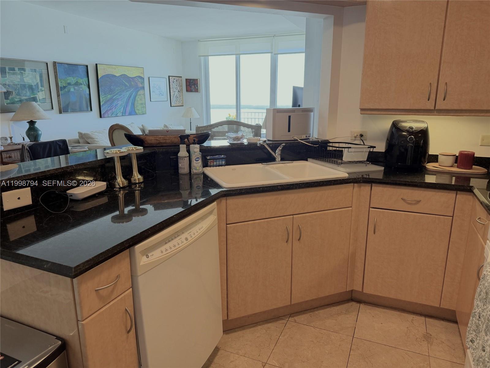 801 Brickell Key Boulevard, Unit 3207 Miami, FL 33131 - Photo 23 of 67 a kitchen with sink cabinets and appliances