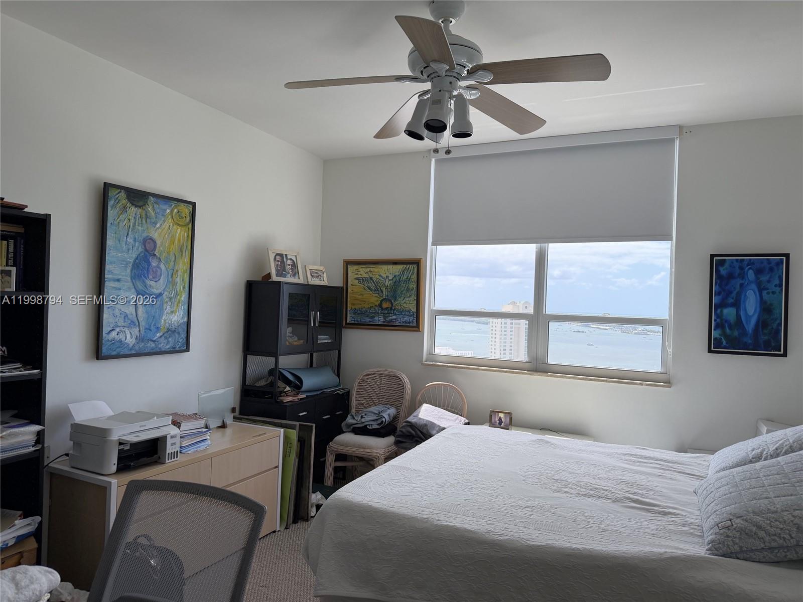 801 Brickell Key Boulevard, Unit 3207 Miami, FL 33131 - Photo 26 of 67 a bedroom with a bed furniture and a window