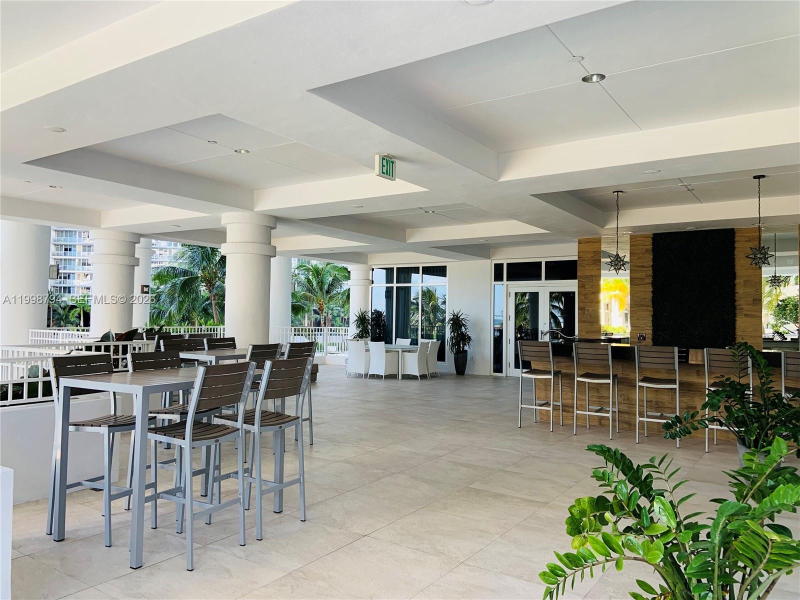 801 Brickell Key Boulevard, Unit 3207 Miami, FL 33131 - Photo 35 of 67 a view of a dining area with furniture