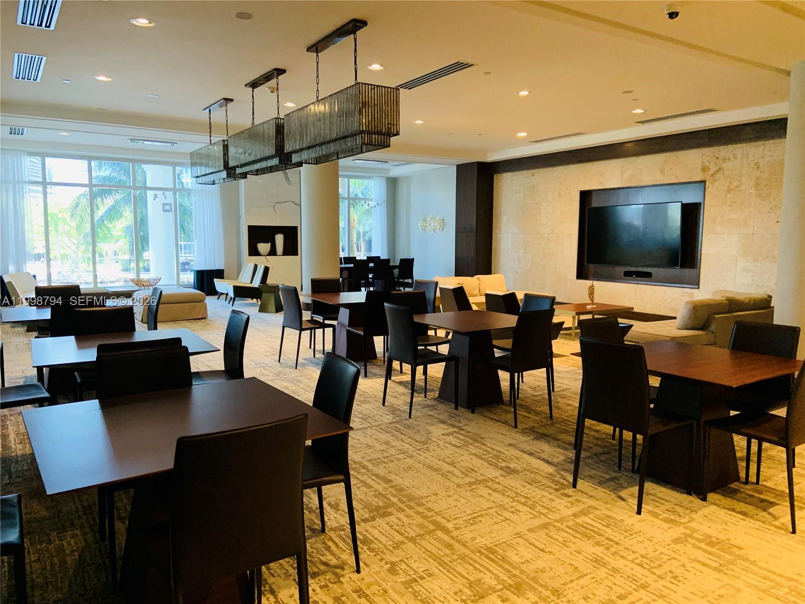 801 Brickell Key Boulevard, Unit 3207 Miami, FL 33131 - Photo 36 of 67 a view of a dining room with furniture