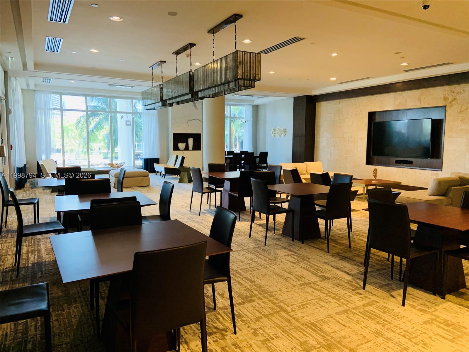 801 Brickell Key Boulevard, Unit 3207 Miami, FL 33131 - Photo 39 of 67 a view of a dining room with furniture
