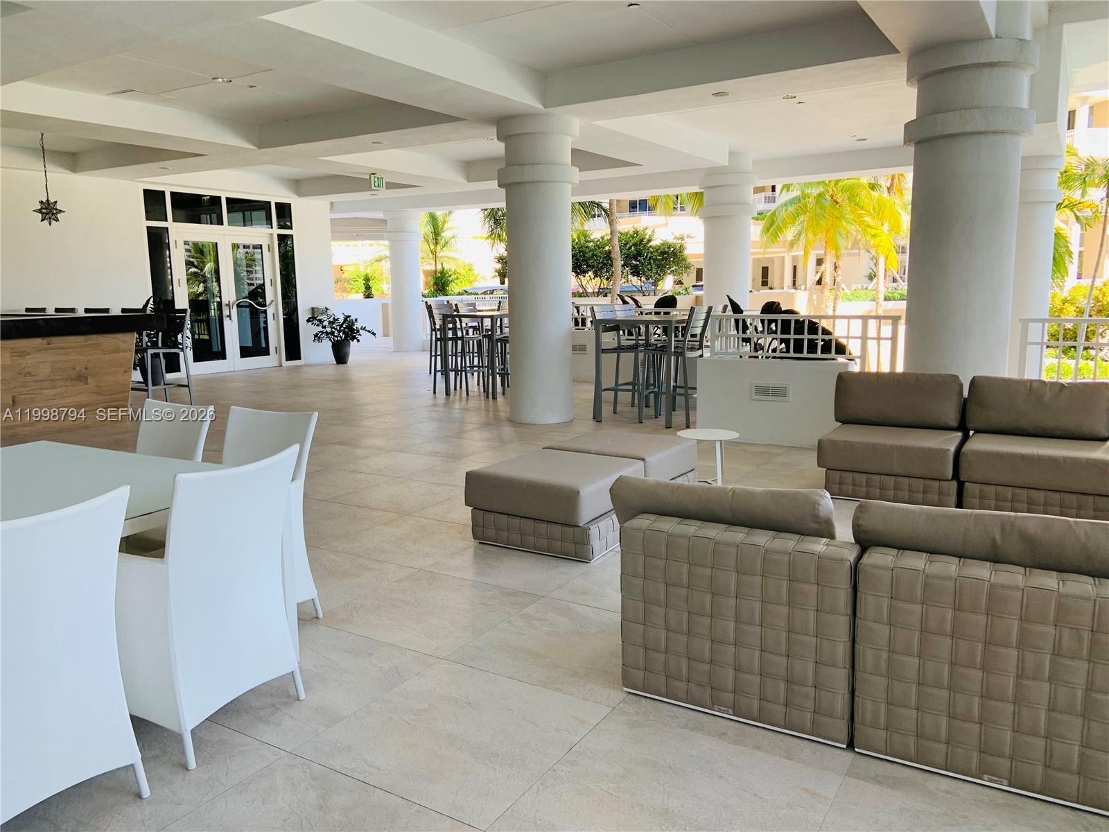 801 Brickell Key Boulevard, Unit 3207 Miami, FL 33131 - Photo 40 of 67 a living room with furniture and a large window