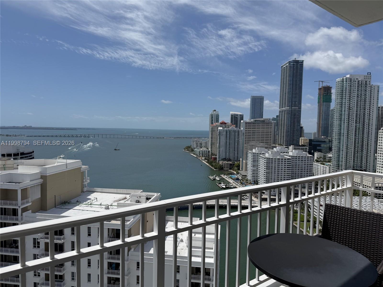 801 Brickell Key Boulevard, Unit 3207 Miami, FL 33131 - Photo 4 of 67 a view of a balcony with two chairs