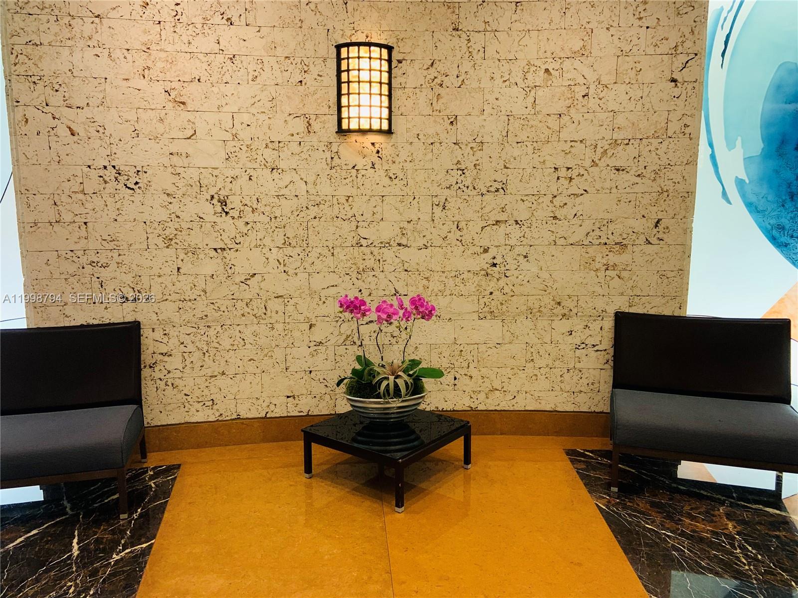 801 Brickell Key Boulevard, Unit 3207 Miami, FL 33131 - Photo 42 of 67 a building with a couch