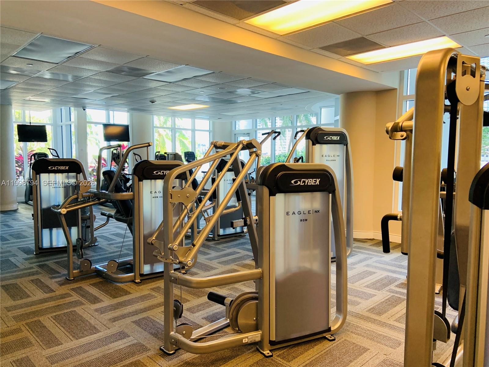 801 Brickell Key Boulevard, Unit 3207 Miami, FL 33131 - Photo 44 of 67 a view of a room with gym equipment