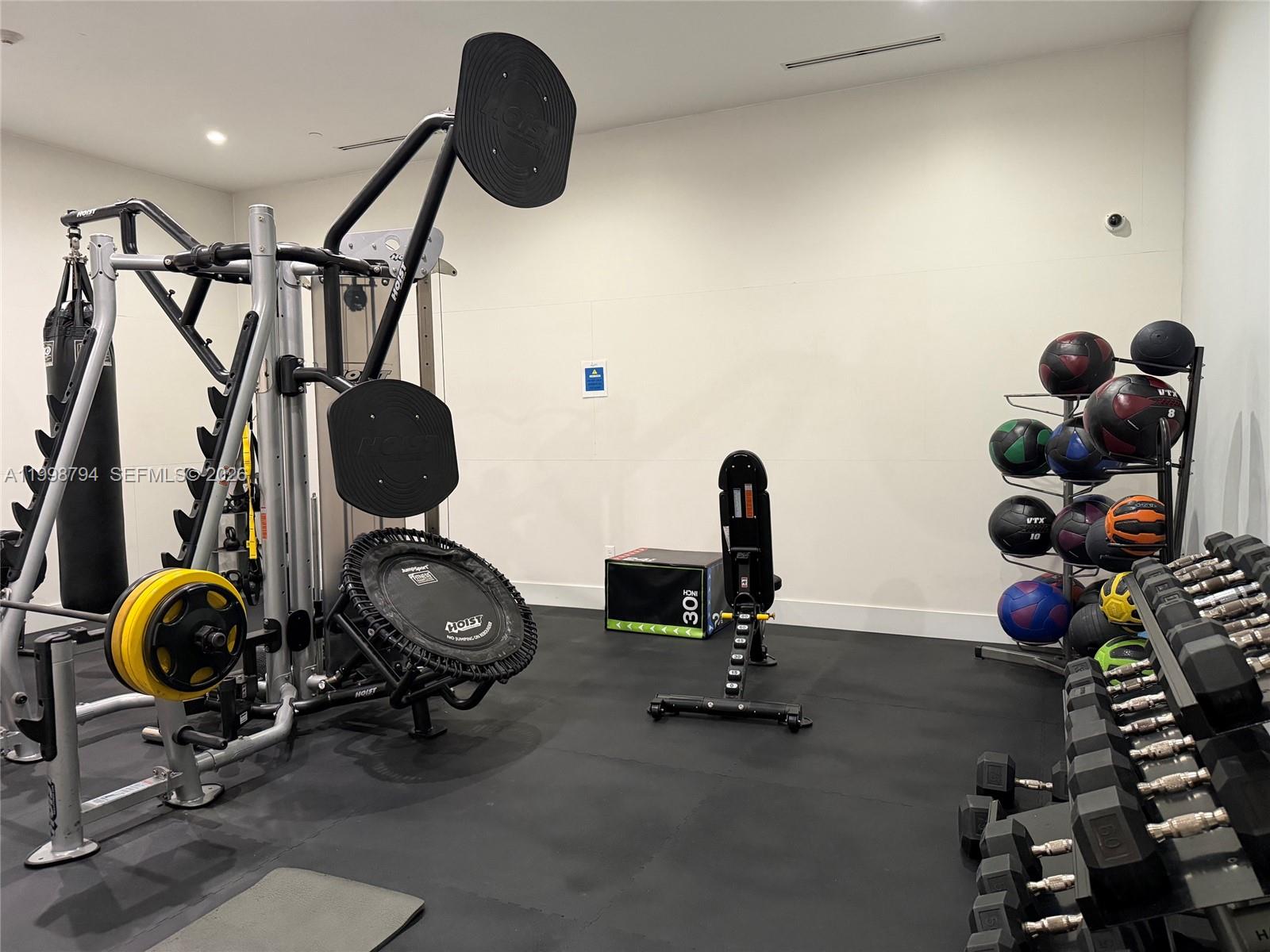 801 Brickell Key Boulevard, Unit 3207 Miami, FL 33131 - Photo 46 of 67 a view of a room with gym equipment