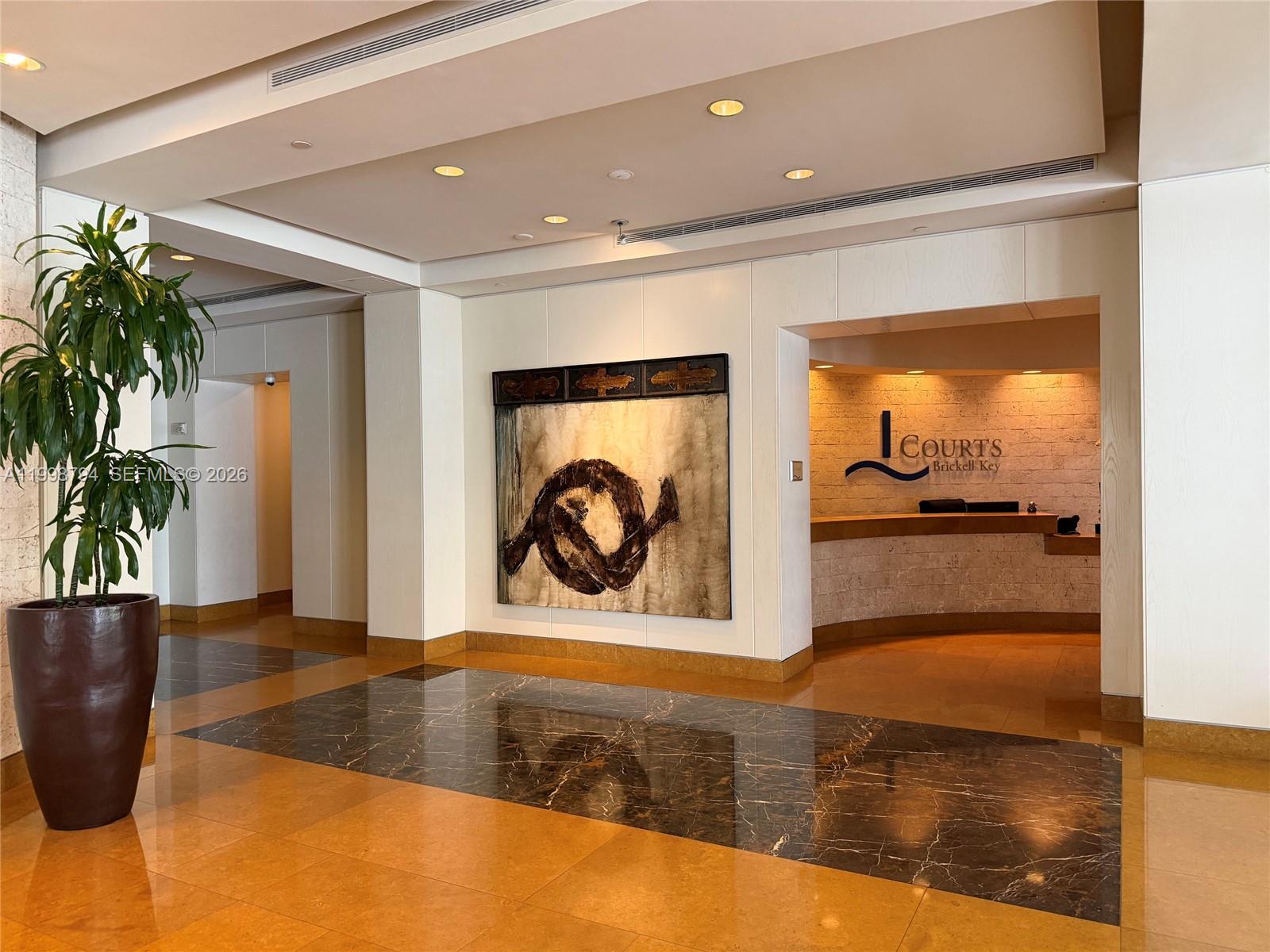 801 Brickell Key Boulevard, Unit 3207 Miami, FL 33131 - Photo 62 of 67 a view of a living room and a potted plant