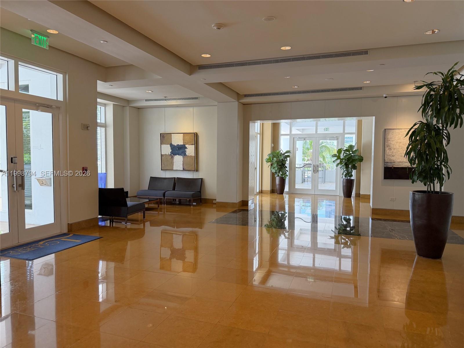 801 Brickell Key Boulevard, Unit 3207 Miami, FL 33131 - Photo 65 of 67 a living room with furniture