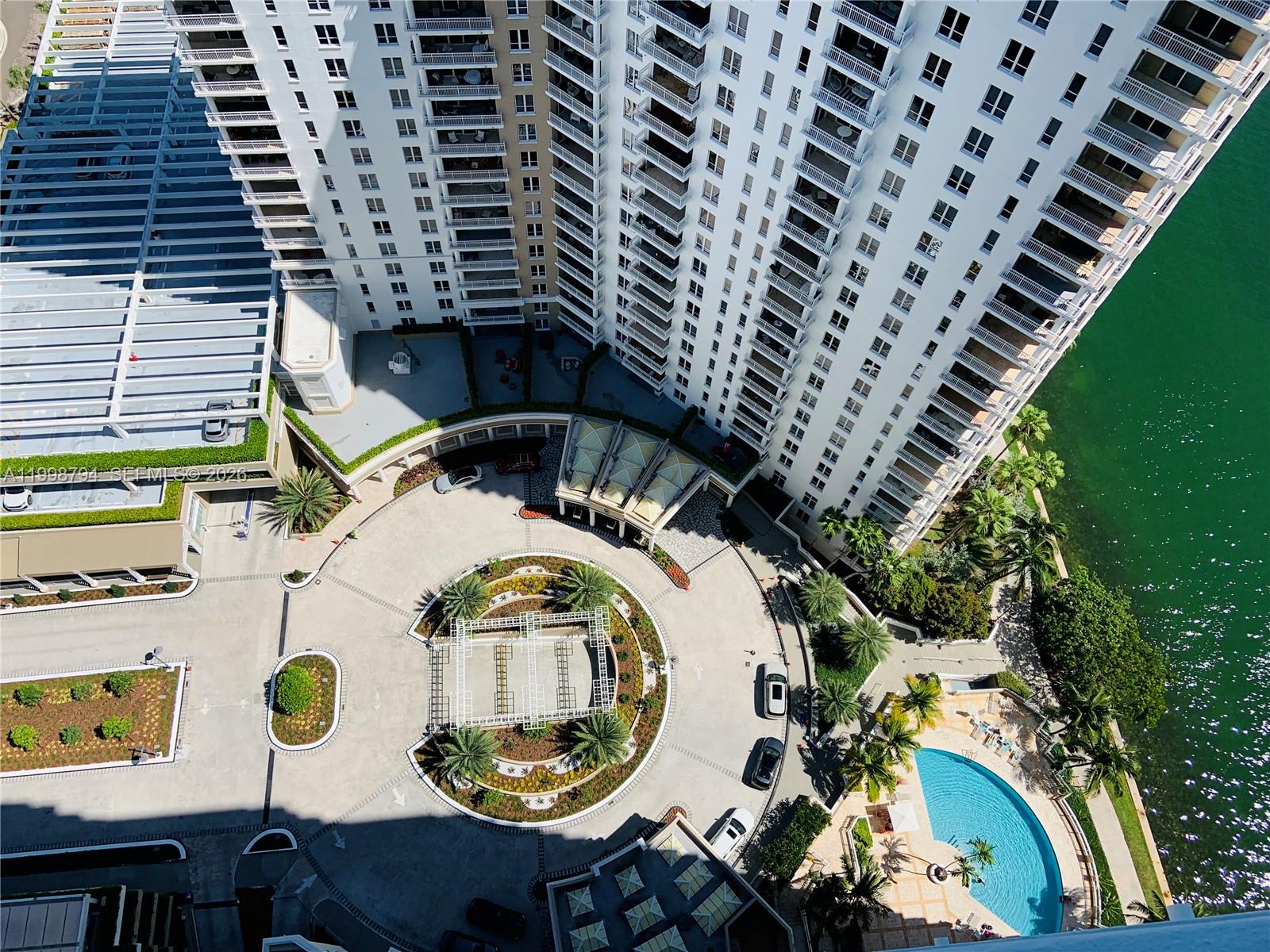 801 Brickell Key Boulevard, Unit 3207 Miami, FL 33131 - Photo 7 of 67 a view of a chairs and table in the patio