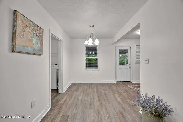 a kitchen with stainless steel appliances granite countertop a refrigerator sink and stove
