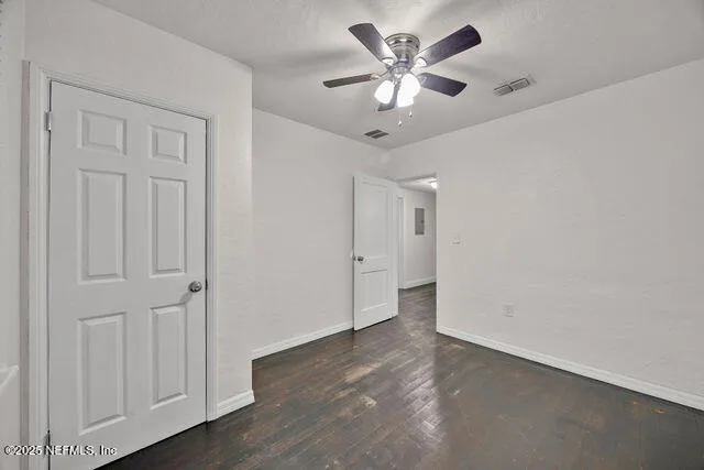 a view of a patio with table and chairs with wooden floor and fence