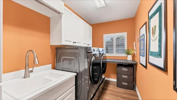 a kitchen with stainless steel appliances a sink a stove and a refrigerator