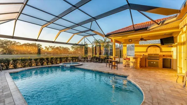 a view of a swimming pool with a patio