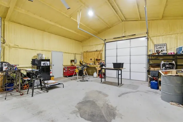 a view of a garage with storage and utility