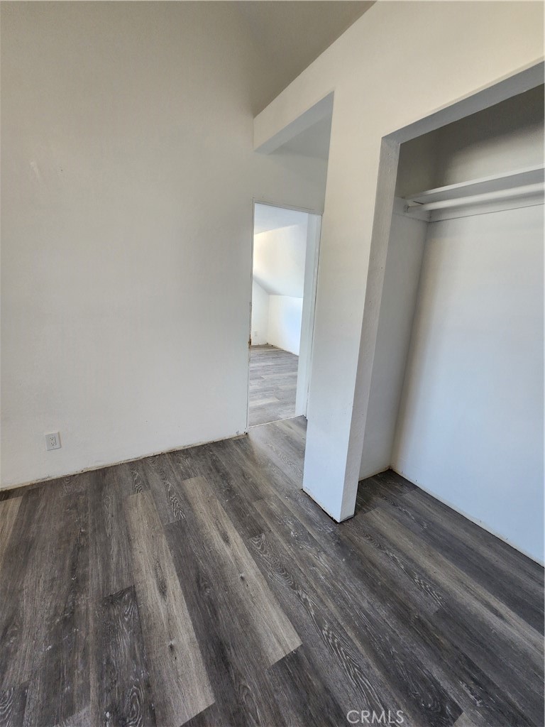 700 East Compton Boulevard Compton, CA 90220 - Photo 13 of 21 a view of an empty room with wooden floor and a window