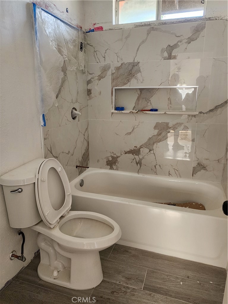 700 East Compton Boulevard Compton, CA 90220 - Photo 17 of 21 a white toilet sitting next to a bathroom sink and tub