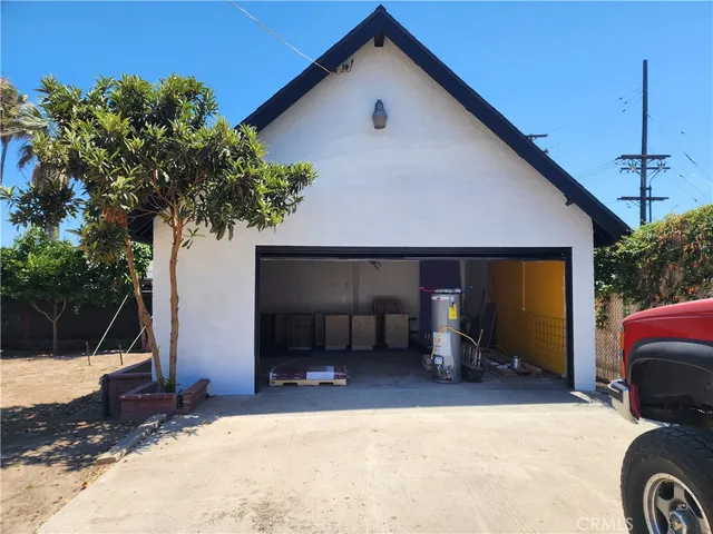 a view of a house with a yard and garage