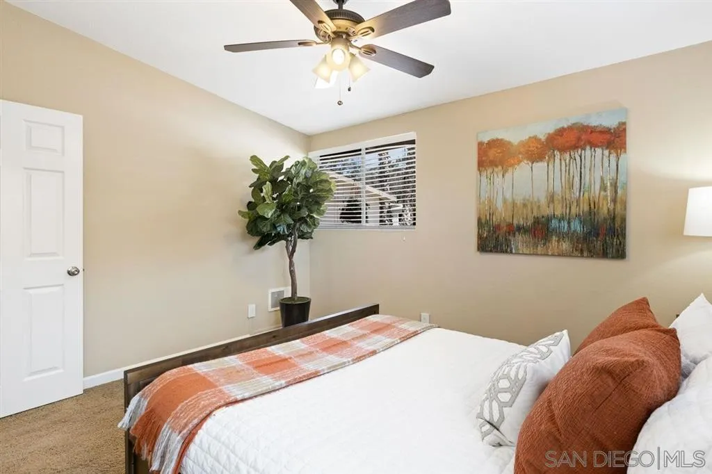 13916 Frame Road Poway, CA 92064 - Photo 13 of 19 a bedroom with a bed and a chandelier