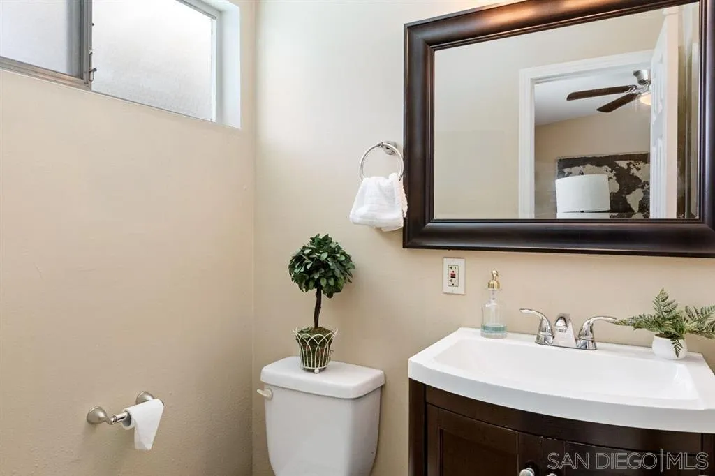 13916 Frame Road Poway, CA 92064 - Photo 15 of 19 a bathroom with a toilet sink and mirror