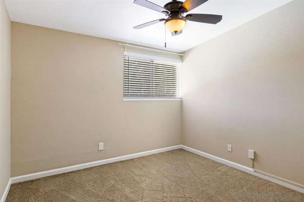 13916 Frame Road Poway, CA 92064 - Photo 17 of 19 an empty room with a window and a fan