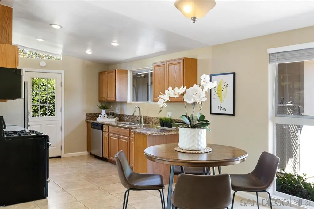 13916 Frame Road Poway, CA 92064 - Photo 7 of 19 a kitchen with a table and chairs