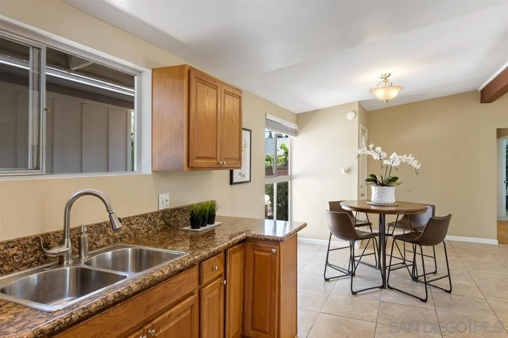 13916 Frame Road Poway, CA 92064 - Photo 8 of 19 a kitchen with a sink cabinets and window