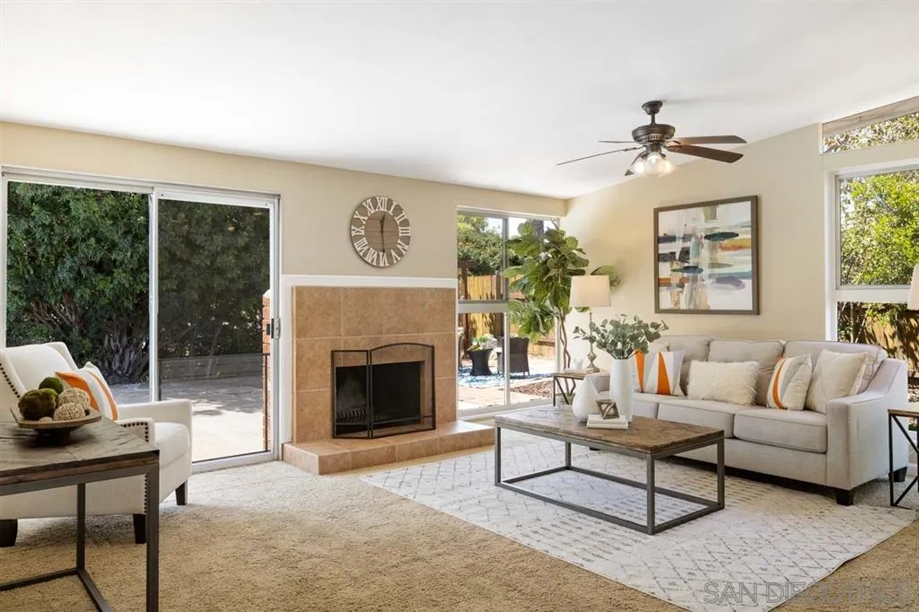13916 Frame Road Poway, CA 92064 - Photo 9 of 19 a living room with furniture a fireplace and a floor to ceiling window