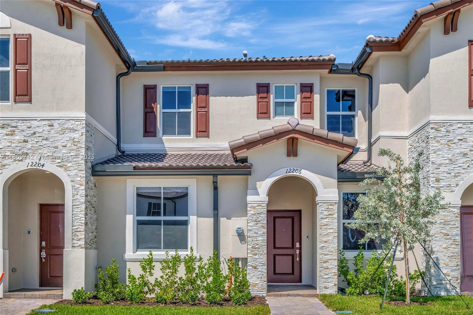 front view of a house with a yard