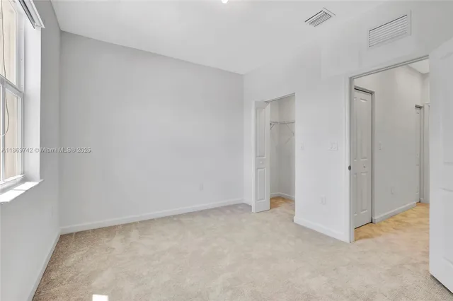 a view of an empty room and window